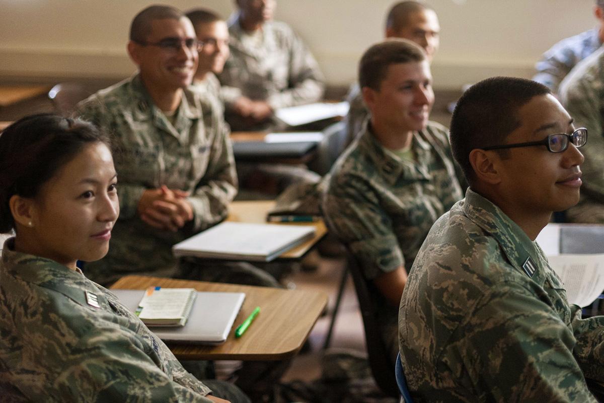 菠菜网lol正规平台 students in uniform sitting in a classroom.